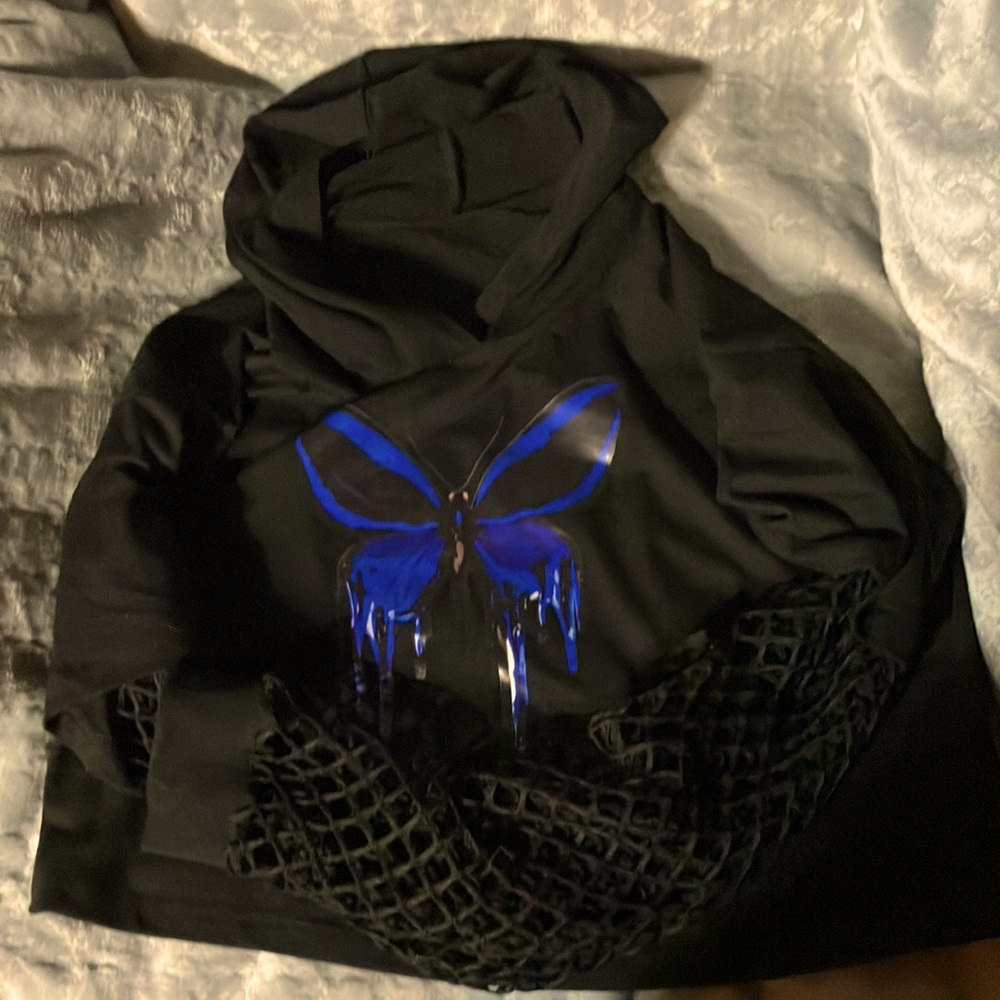 This is a medium lace sleeved crop top with a hood